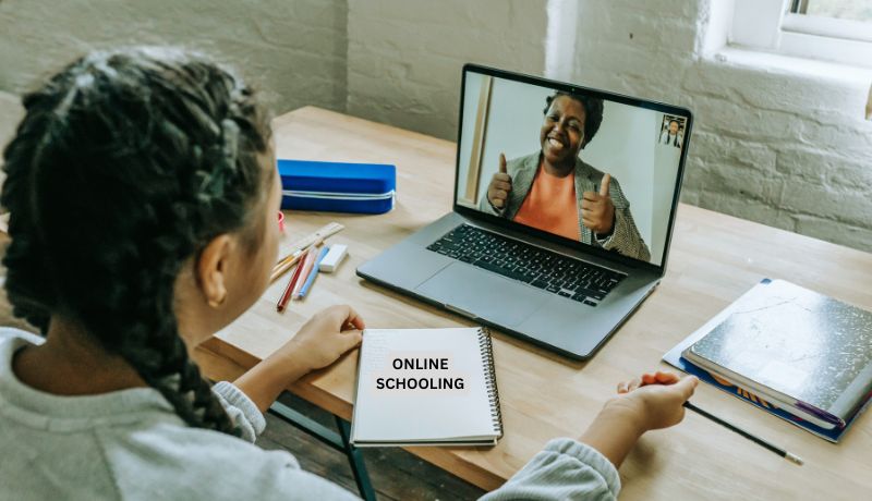 A person participating in an online schooling session.
